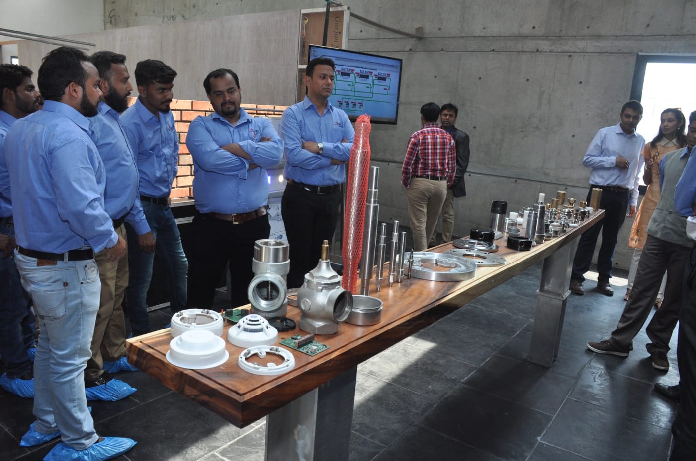 Engineering team reviewing forged and cast parts